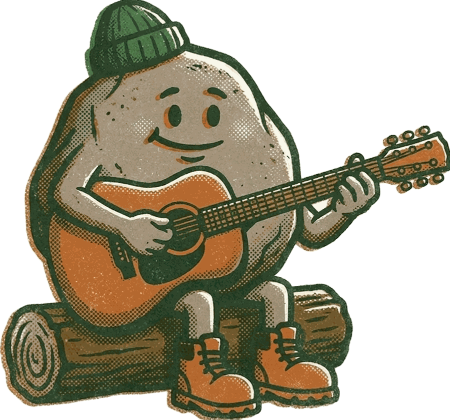 Barry Boulder sitting on a log playing an acoustic guitar