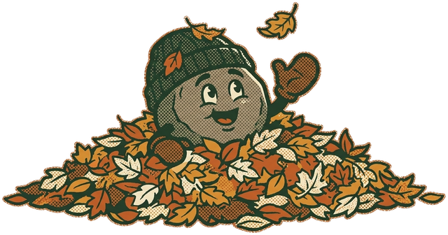 Barry Boulder peeking out of a leaf pile